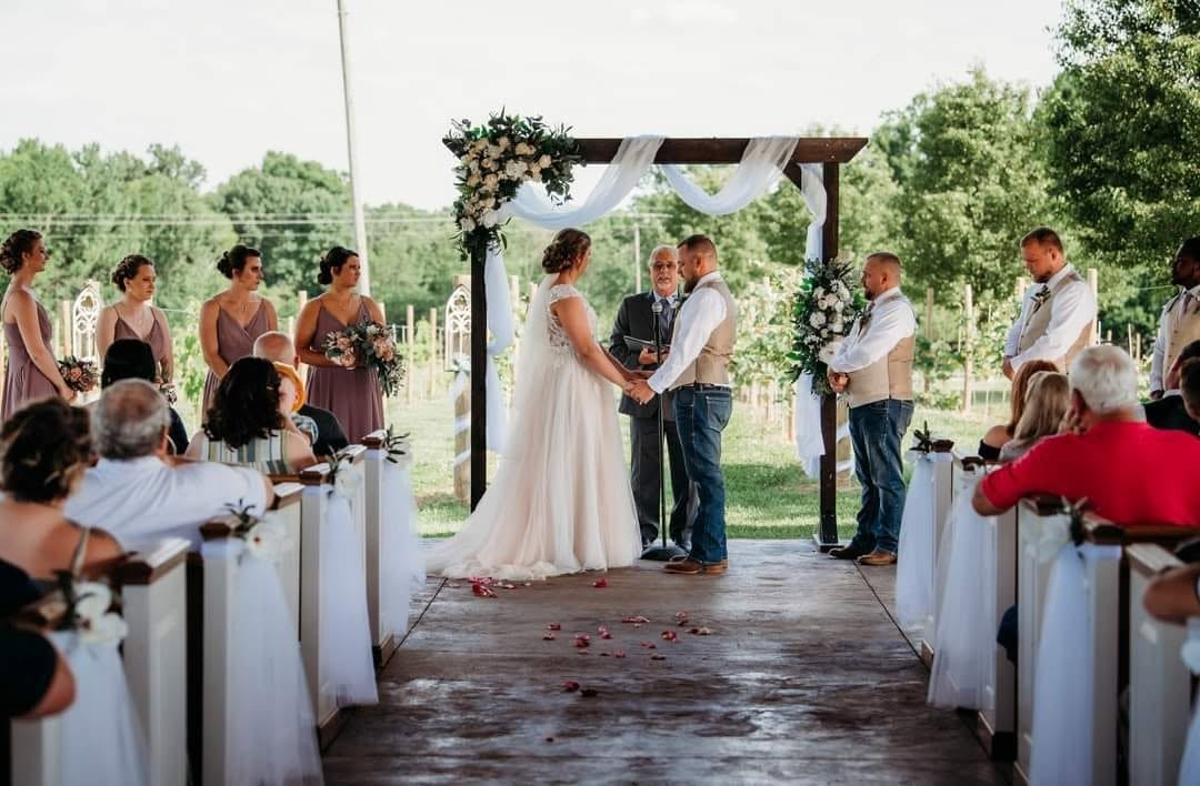 Couple exchanging vows at the open-air chapel
