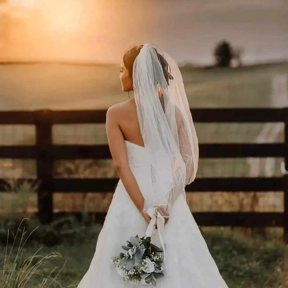 Bride by the pond at The Lodge at Logan Vineyards